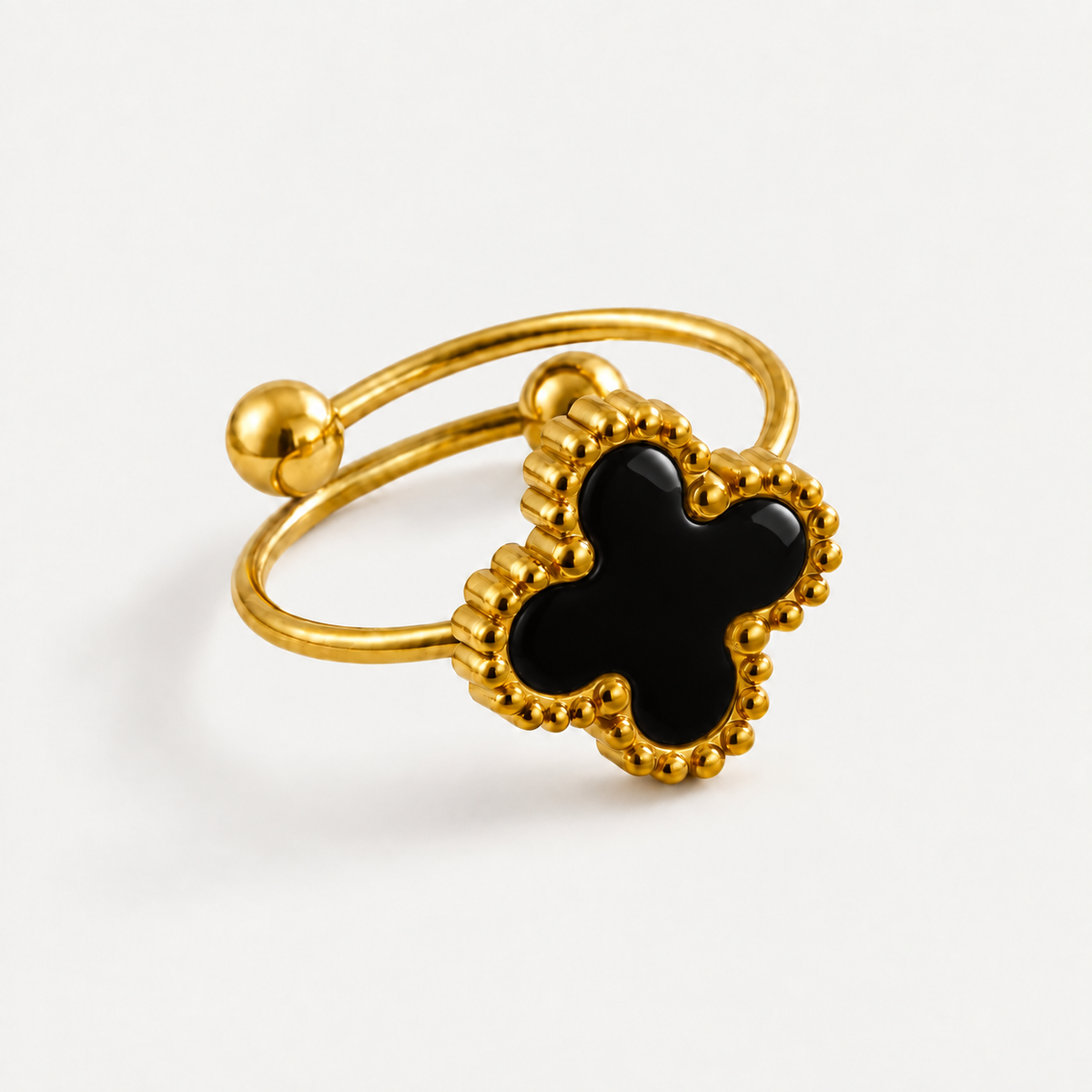 Bague Éclipse ajourée en acier inoxydable, finition doré noir — vue studio