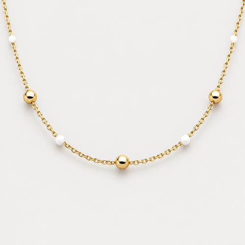 Collier Éclat billes en acier inoxydable, finition dorée — vue studio