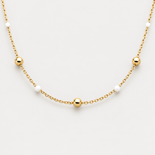 Collier Éclat billes en acier inoxydable, finition dorée — vue studio